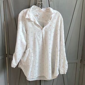 White collared shirt with mini silver and gold colored palm trees.